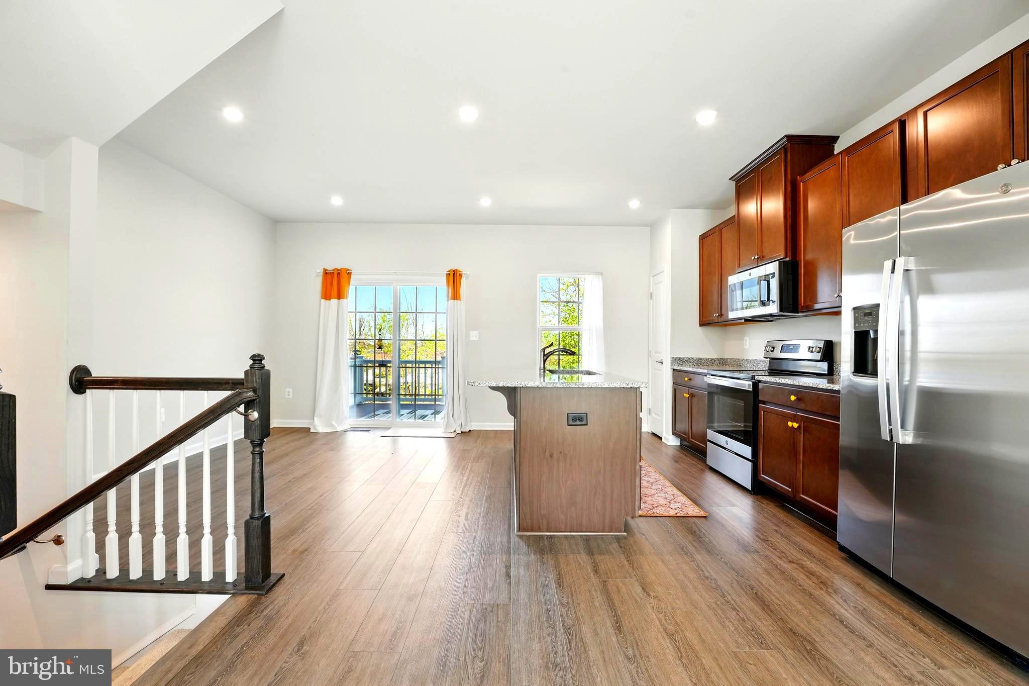 1754 Scenic Loop Culpeper, VA 22701 - Photo 2 of 39 a kitchen with stainless steel appliances a refrigerator and wooden floor