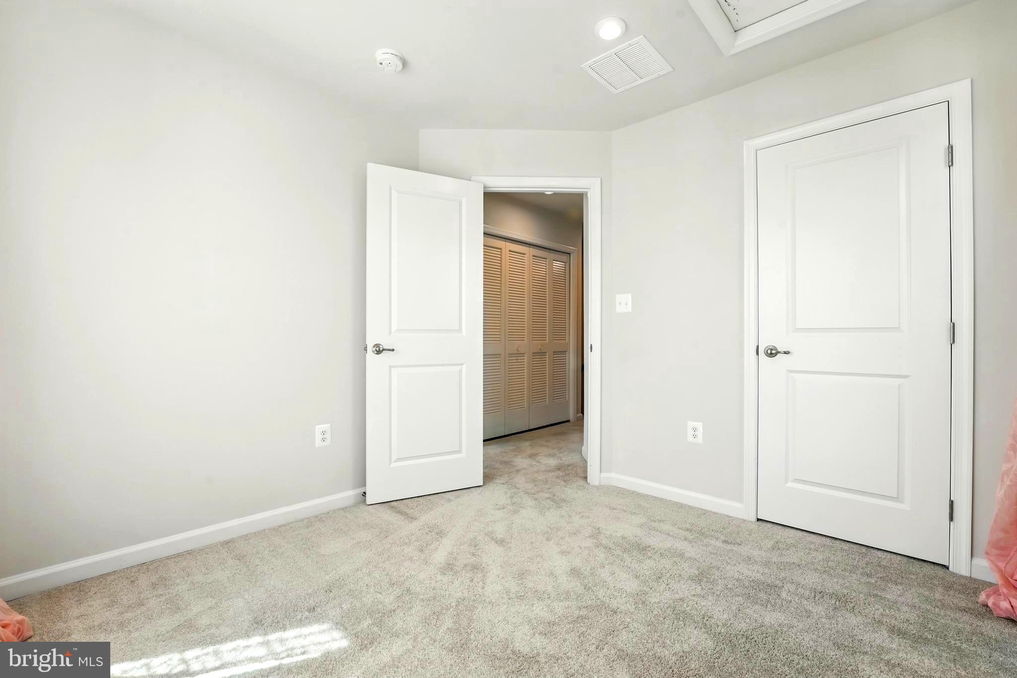 1754 Scenic Loop Culpeper, VA 22701 - Photo 22 of 39 an empty room with closet and mirror