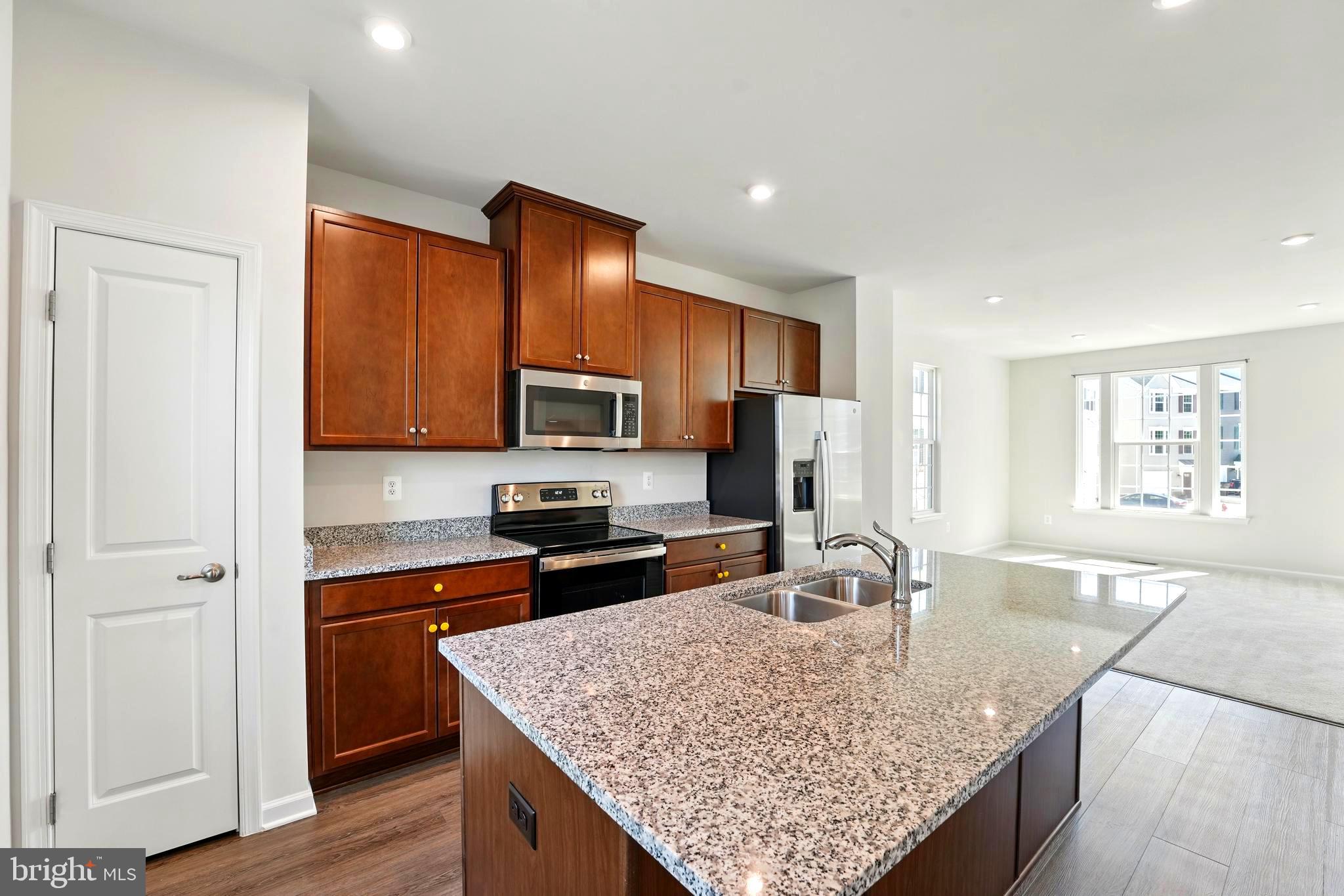 1754 Scenic Loop Culpeper, VA 22701 - Photo 3 of 39 a kitchen with stainless steel appliances granite countertop a sink stove and refrigerator