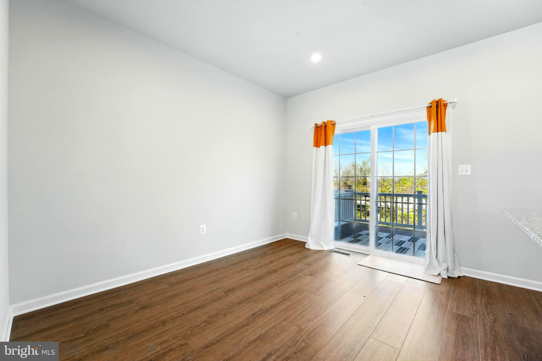 1754 Scenic Loop Culpeper, VA 22701 - Photo 8 of 39 wooden floor in an empty room with a window