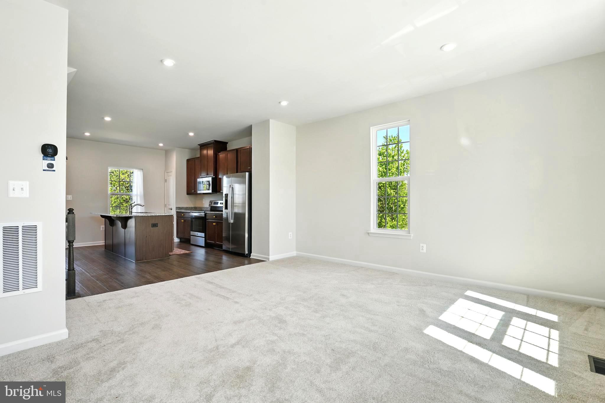1754 Scenic Loop Culpeper, VA 22701 - Photo 9 of 39 an empty room with kitchen view and a window