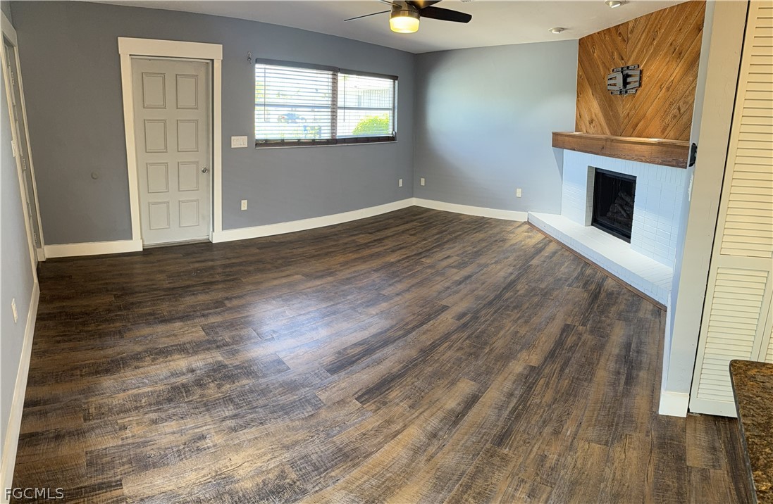 1534 Ricardo Avenue Fort Myers, FL 33901 - Photo 14 of 22 an empty room with wooden floor cabinet and windows