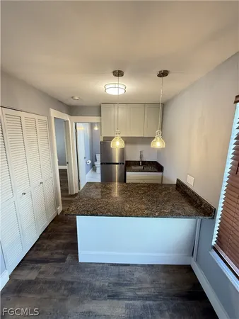 a view of living room with furniture and window