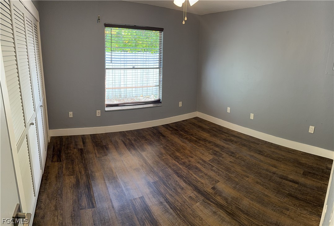 1534 Ricardo Avenue Fort Myers, FL 33901 - Photo 17 of 22 wooden floor in an empty room with a window