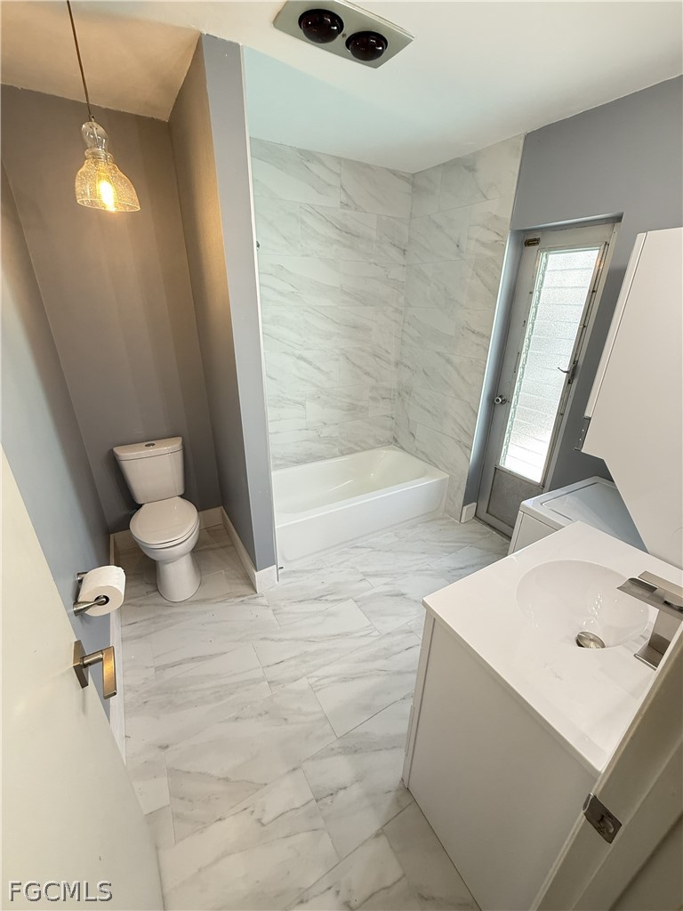 1534 Ricardo Avenue Fort Myers, FL 33901 - Photo 18 of 22 a bathroom with a sink and a mirror