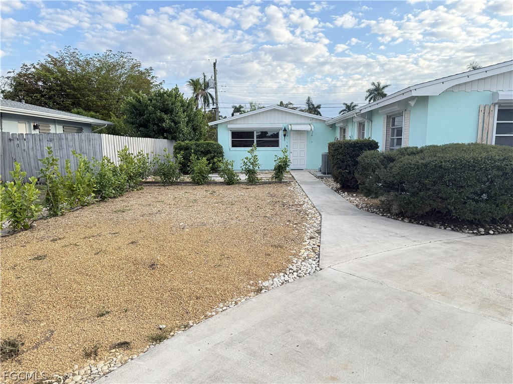 1534 Ricardo Avenue Fort Myers, FL 33901 - Photo 3 of 22 a view of a house with a yard plants and large tree