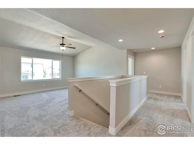 a view of an empty room with windows