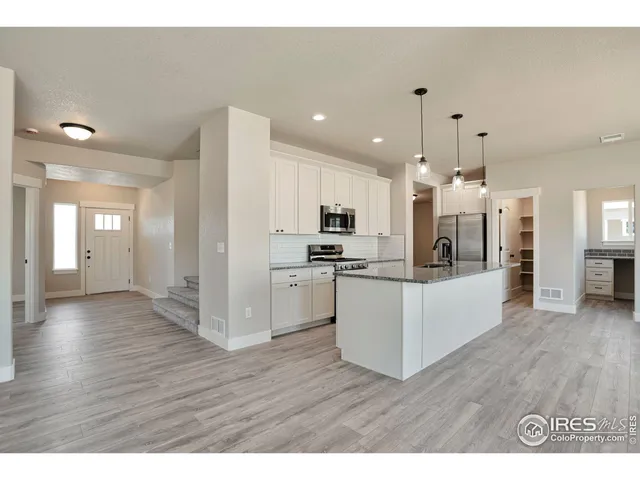 a view of kitchen with wooden floor