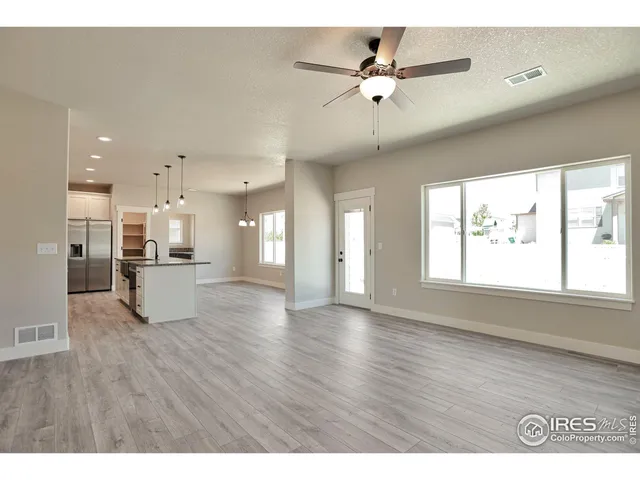 a view of an empty room and window