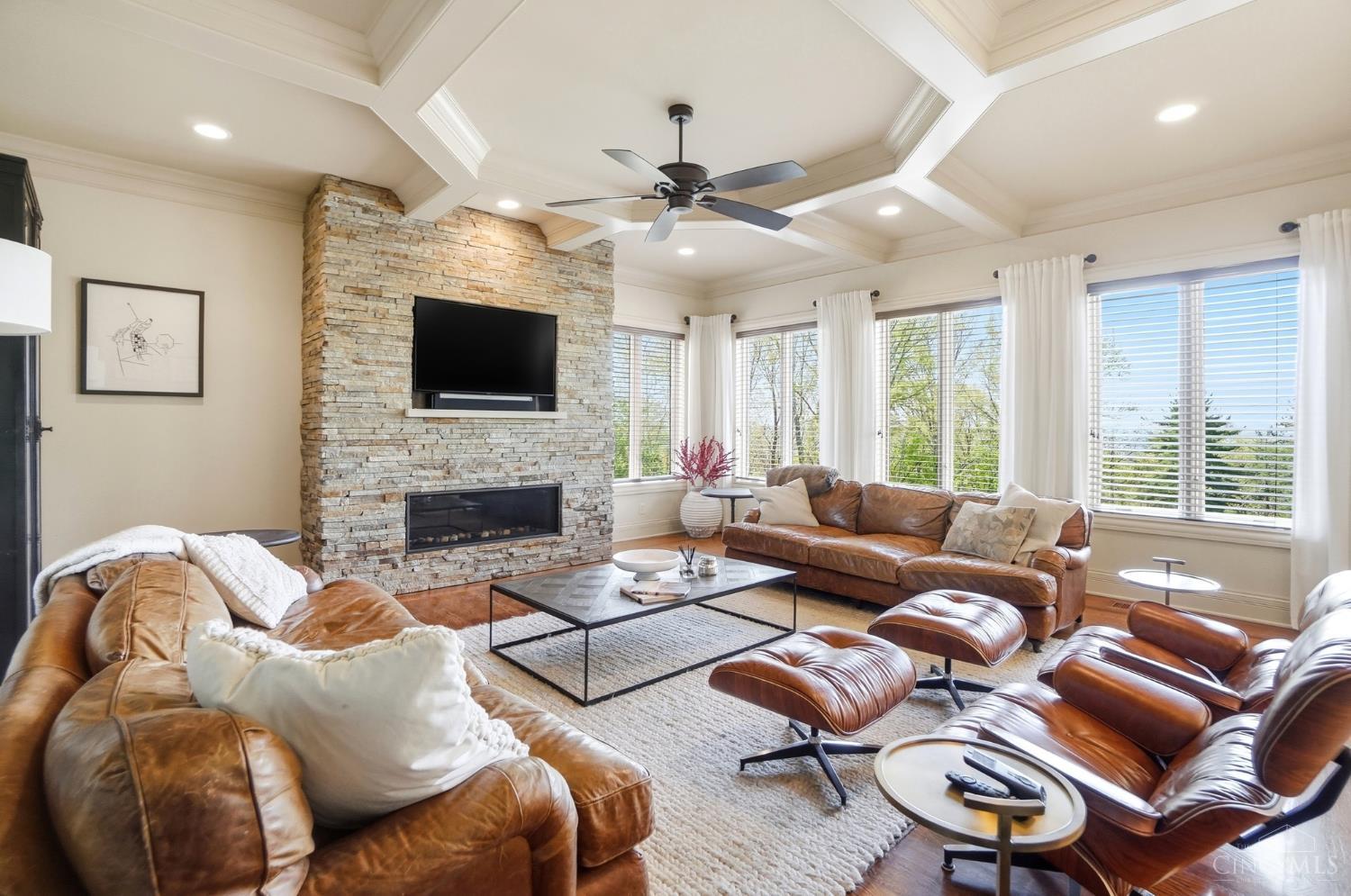4535 Drake Road Cincinnati, OH 45243 - Photo 26 of 96 The family room boasts a beamed ceiling, stone fireplace and hardwood floors.