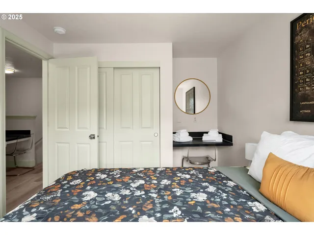 a bedroom with a bed and a couch