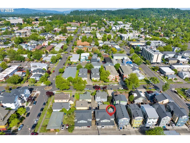 an aerial view of residential houses with outdoor space