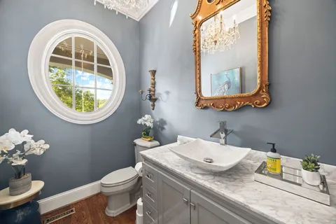 a living room with furniture rug and wooden floor