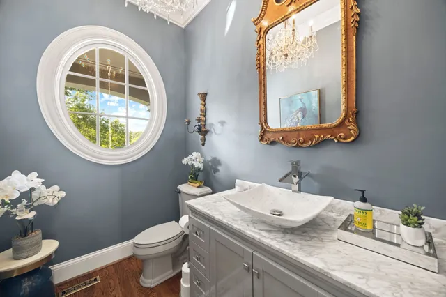 a living room with furniture rug and wooden floor