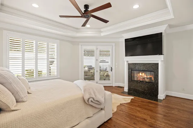 a view of a livingroom with furniture staircase windows and wooden floor