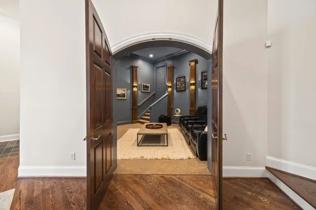 a living room with furniture and a grill