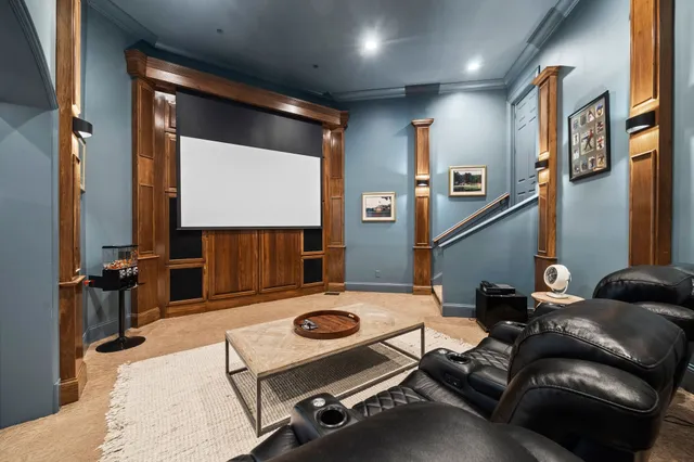 a bath tub sitting in a kitchen next to a large window