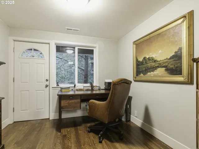 a work room with furniture and a window