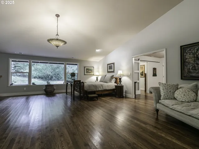 a living room with furniture window and wooden floor