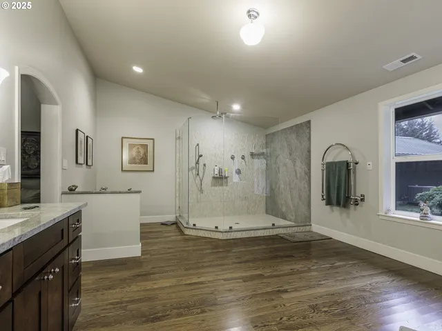 a view of a kitchen with a sink and wooden floor