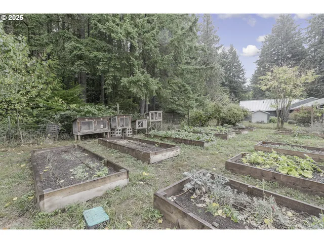 a view of a backyard with sitting area