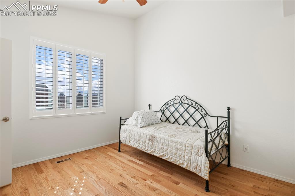 10658 Pictured Rocks Drive Peyton, CO 80831 - Photo 18 of 36 a bedroom with a bed and a window