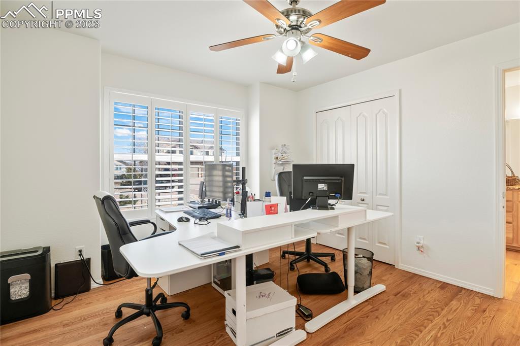 10658 Pictured Rocks Drive Peyton, CO 80831 - Photo 20 of 36 a view of a workspace with furniture and a window