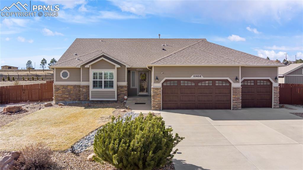 10658 Pictured Rocks Drive Peyton, CO 80831 - Photo 2 of 36 a house view with a outdoor space