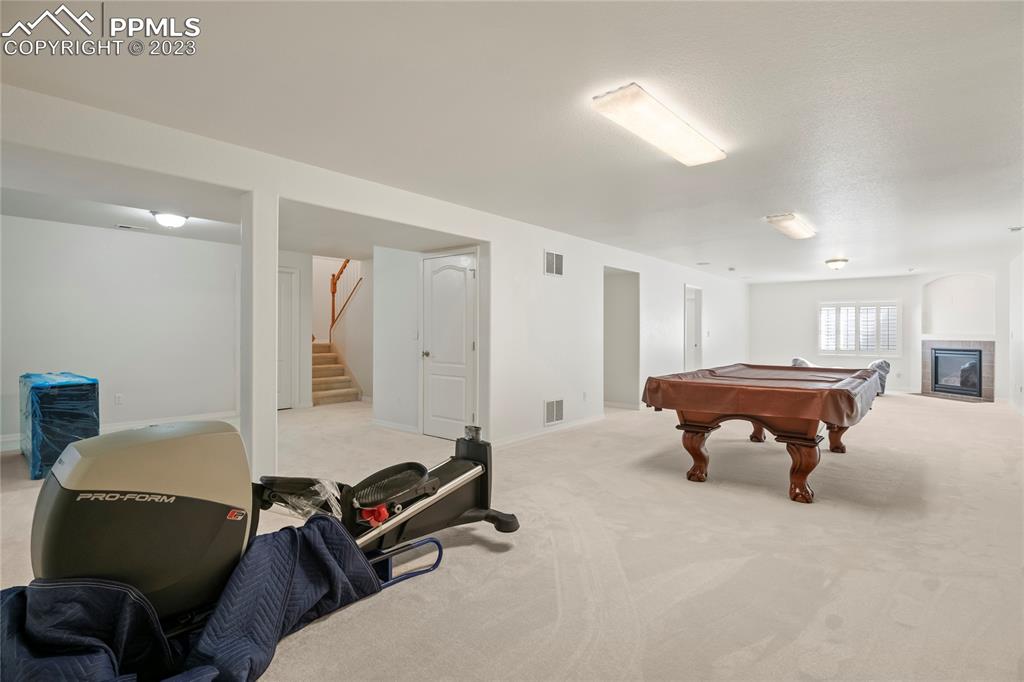 10658 Pictured Rocks Drive Peyton, CO 80831 - Photo 22 of 36 a room with furniture gym equipment and a window