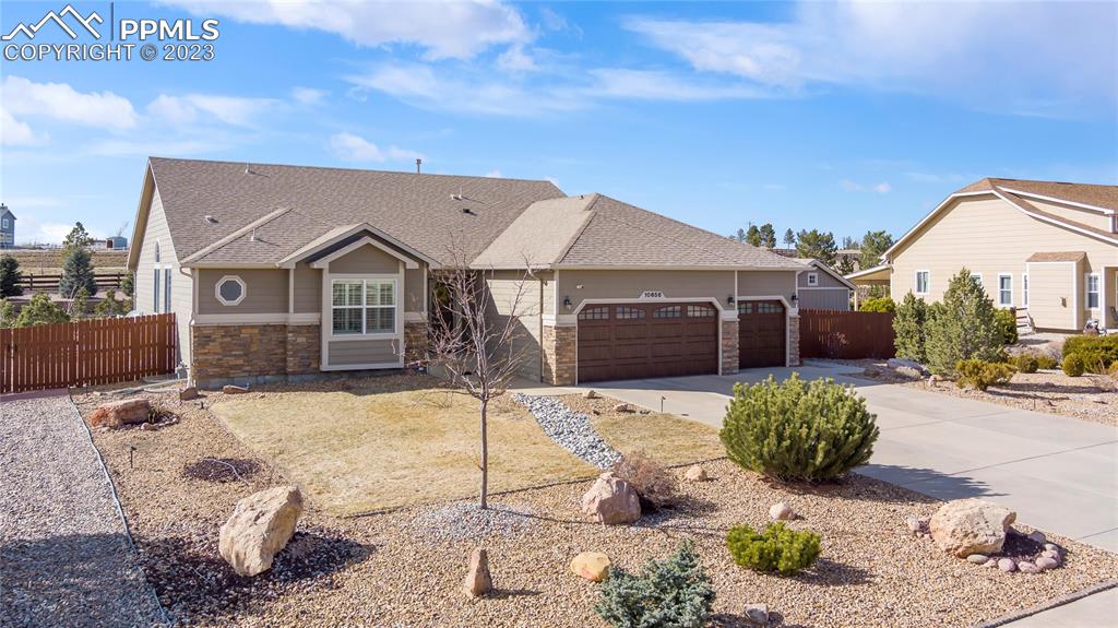10658 Pictured Rocks Drive Peyton, CO 80831 - Photo 3 of 36 a front view of a house with a yard