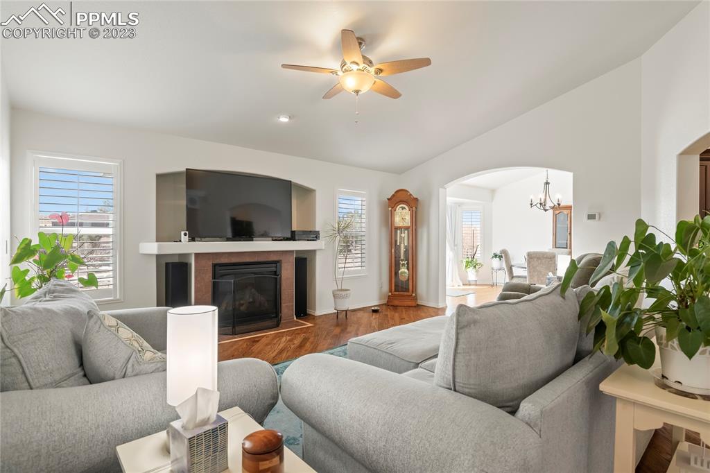 10658 Pictured Rocks Drive Peyton, CO 80831 - Photo 4 of 36 a living room with furniture a fireplace and a flat screen tv