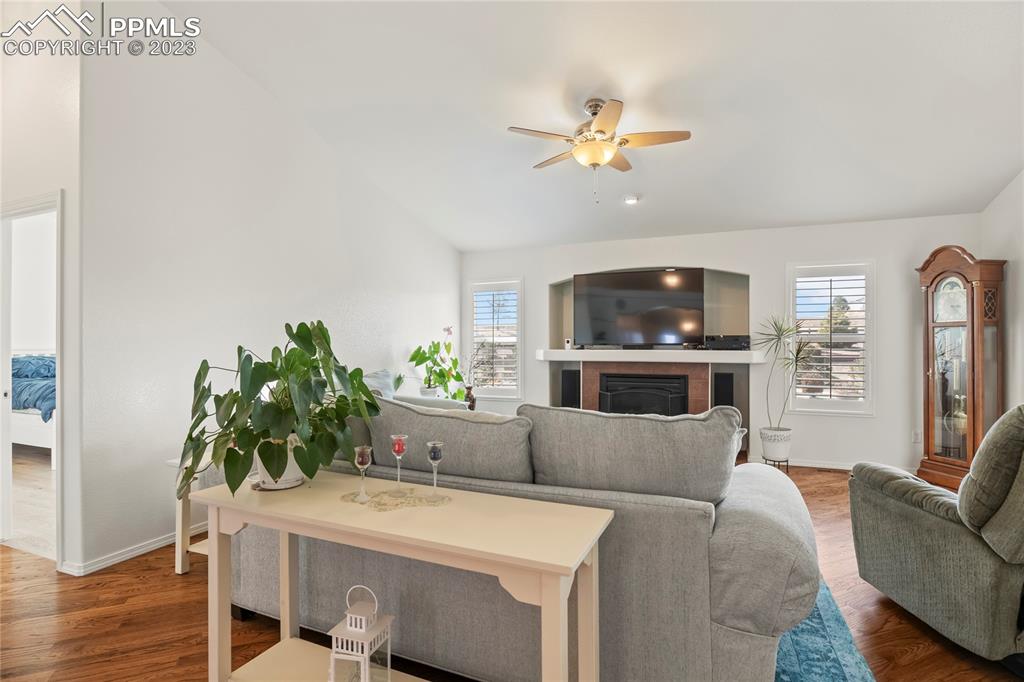 10658 Pictured Rocks Drive Peyton, CO 80831 - Photo 5 of 36 a living room with furniture and a chandelier