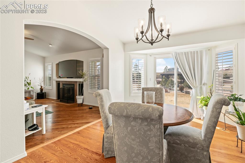 10658 Pictured Rocks Drive Peyton, CO 80831 - Photo 7 of 36 a living room with furniture a large window and a fireplace