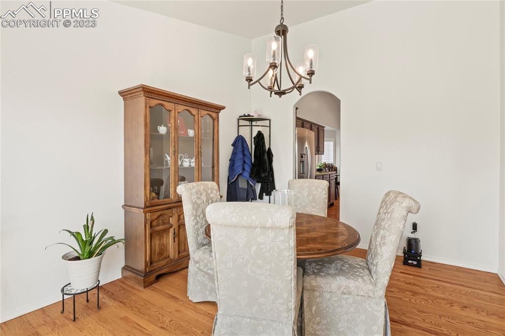 10658 Pictured Rocks Drive Peyton, CO 80831 - Photo 8 of 36 a view of a livingroom with furniture and wooden floor