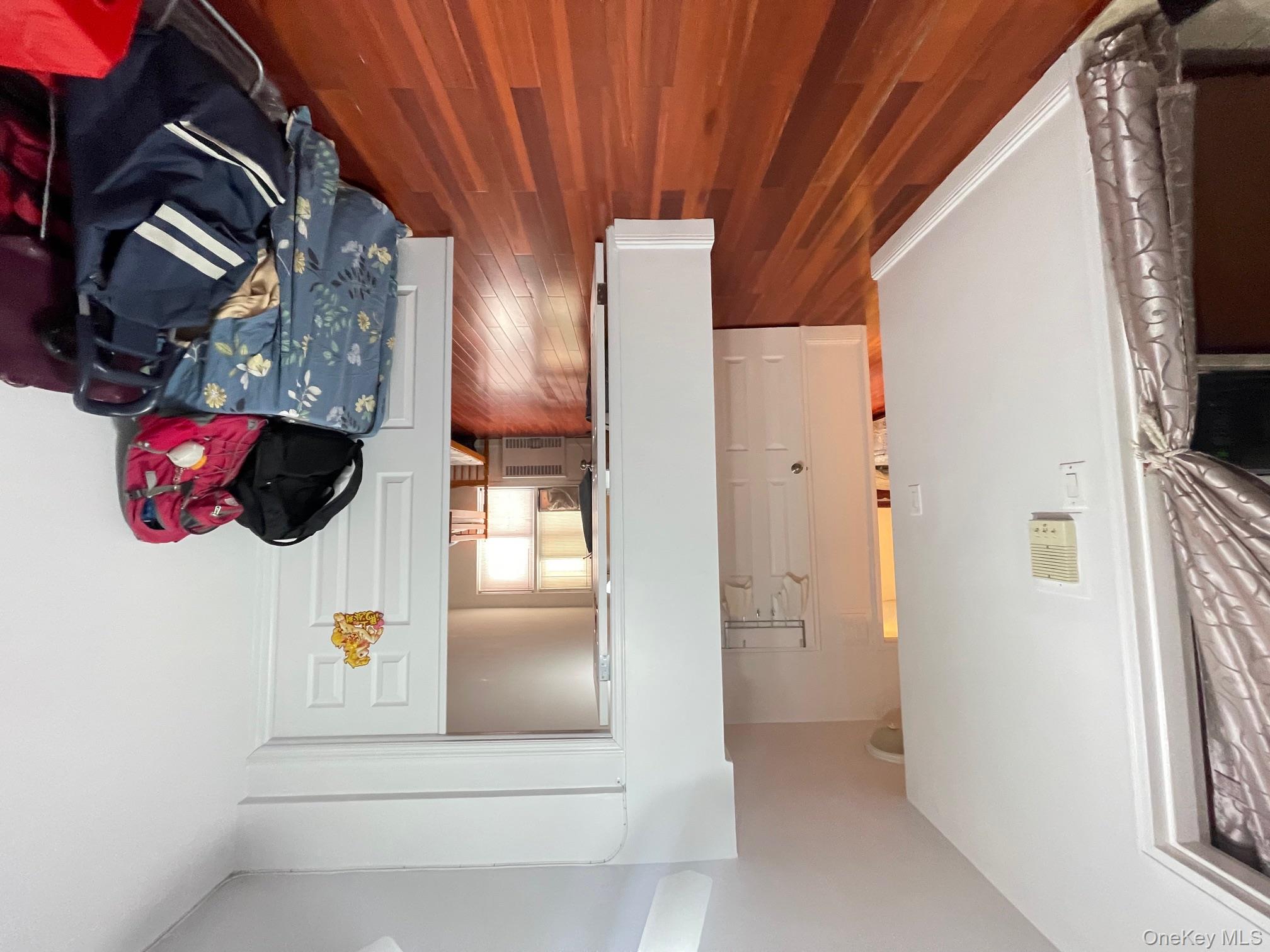 43-35 Union Street, Unit 2M Queens, NY 11355 - Photo 12 of 13 a hallway view with wooden floor and a sink