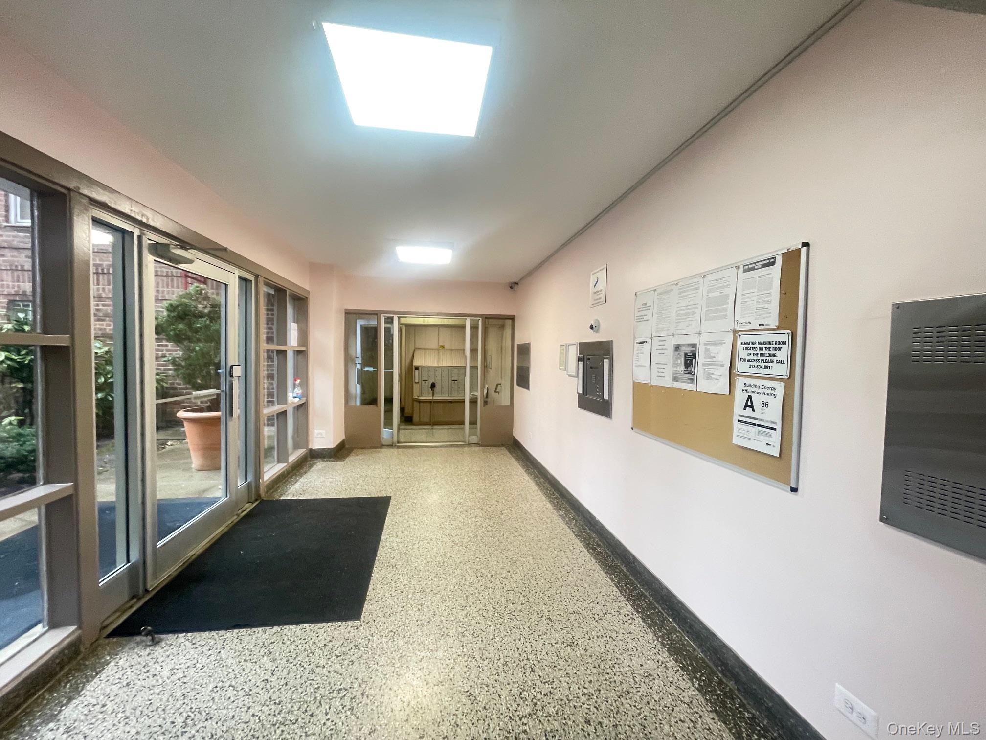 43-35 Union Street, Unit 2M Queens, NY 11355 - Photo 3 of 13 a view of a hallway with an entryway and kitchen area