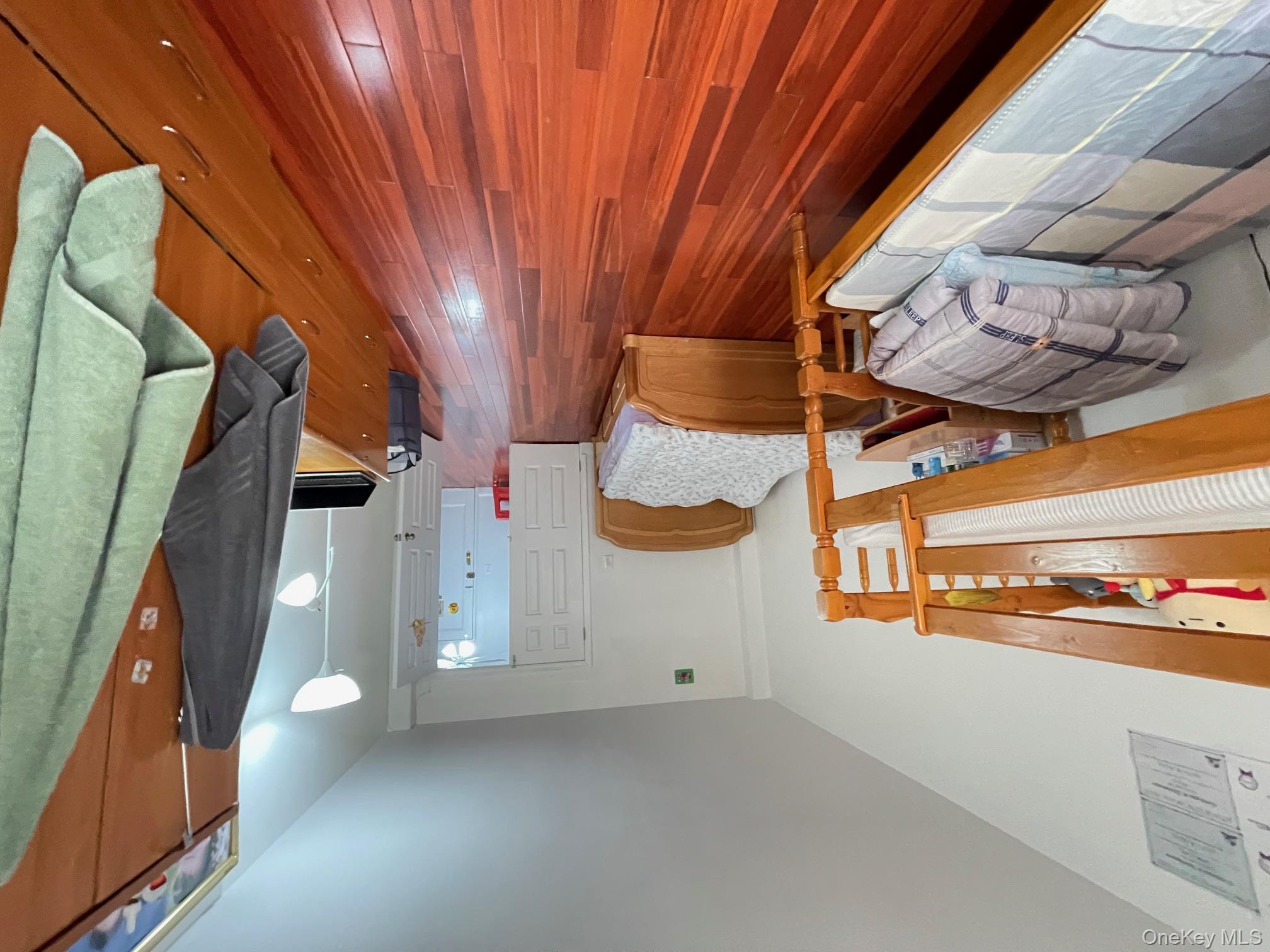 43-35 Union Street, Unit 2M Queens, NY 11355 - Photo 6 of 13 a living room with furniture and a wooden floor