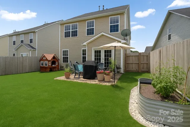 a front view of a house with garden and porch