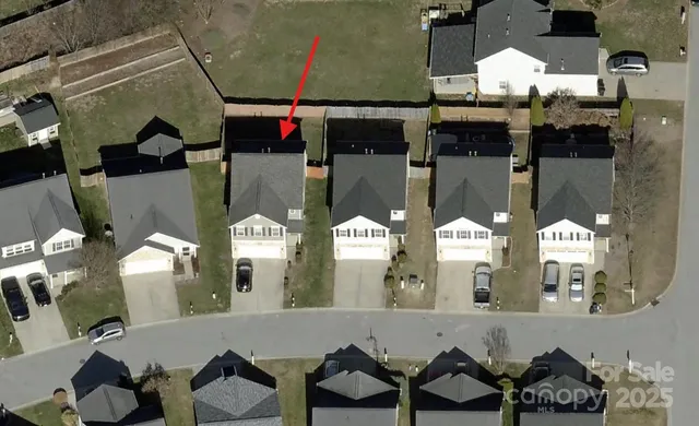a view of a house with pool and a yard