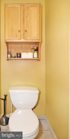 a bathroom with a toilet and a sink