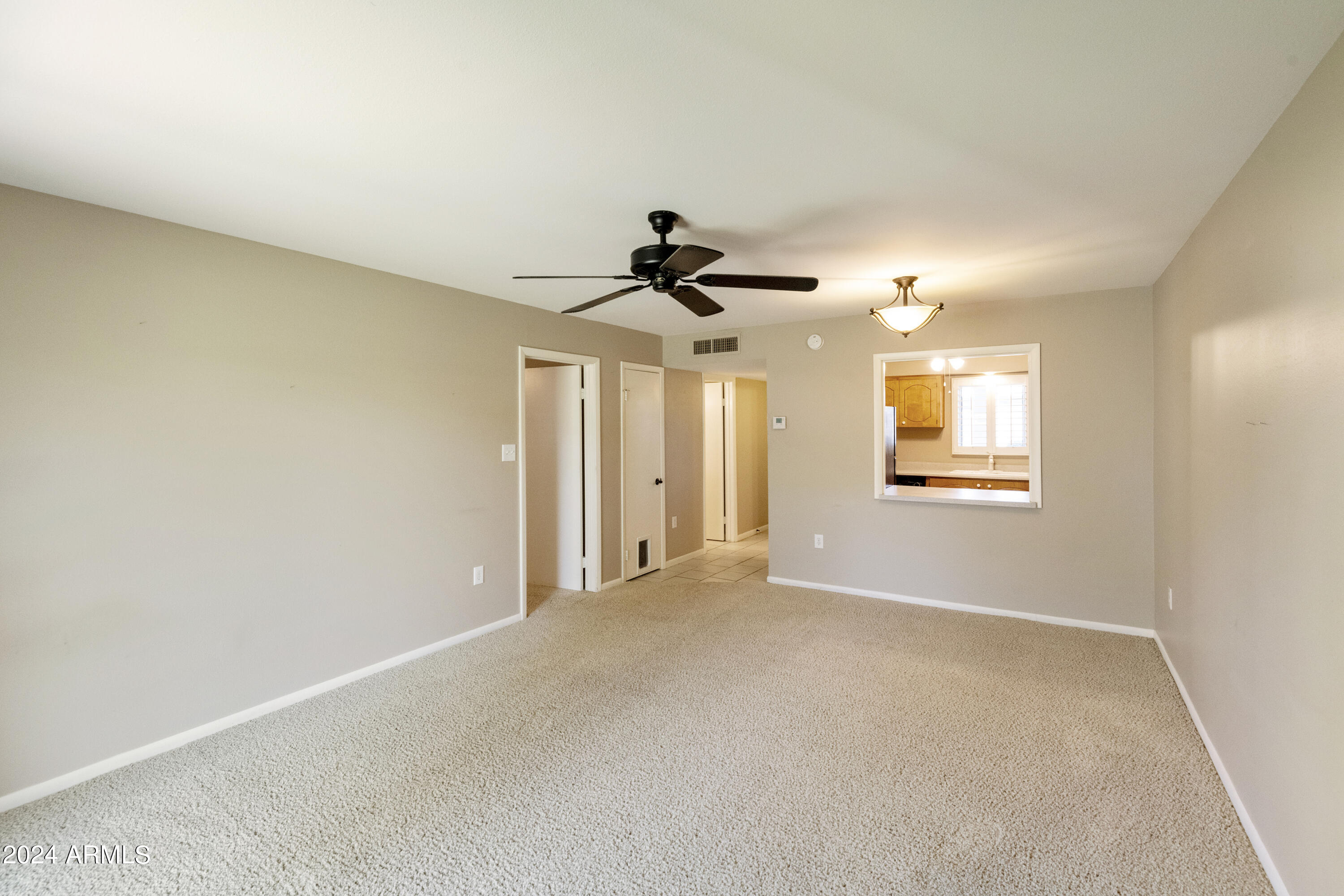 131 North Higley Road, Unit 116 Mesa, AZ 85205 - Photo 11 of 32 116 Living Room Dining Room 2