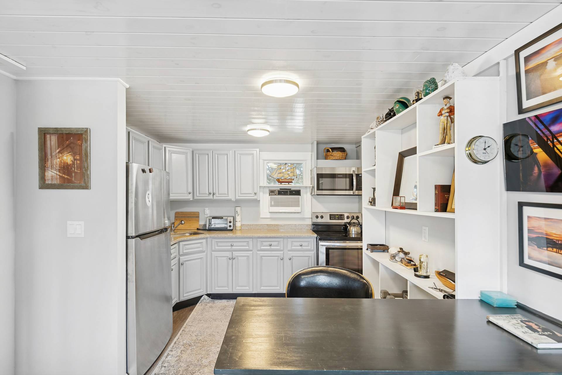 1840 North Sea Road Southampton, NY 11968 - Photo 5 of 7 a kitchen with stainless steel appliances a sink a stove and a refrigerator