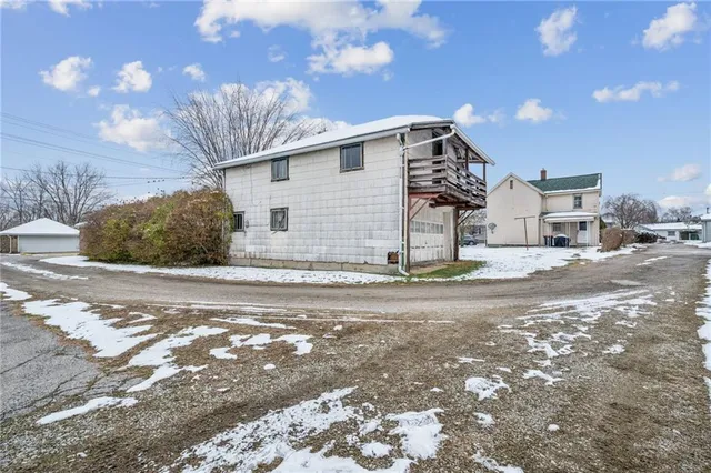 a view of front door with wooden floor