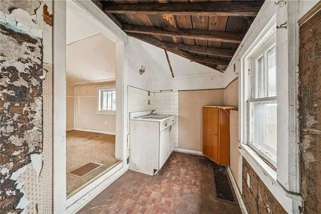 a view of a room with wooden walls