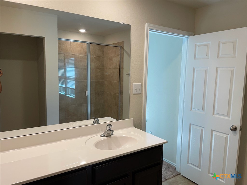 6114 Sally Ride Lane Killeen, TX 76543 - Photo 11 of 21 a bathroom with a sink and a mirror