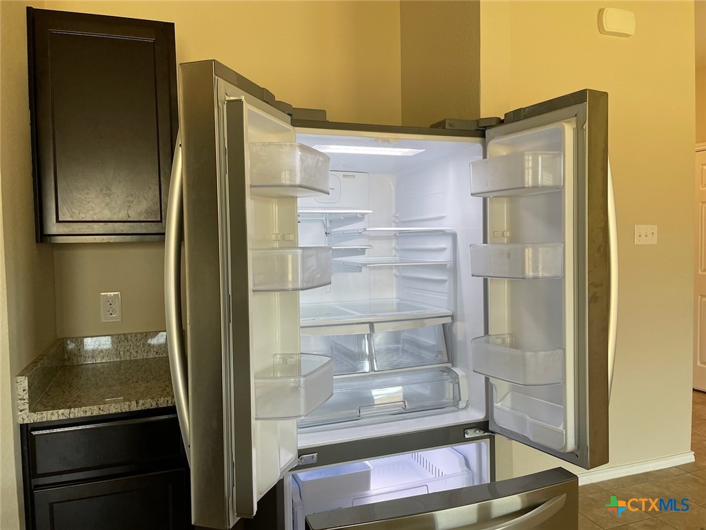 6114 Sally Ride Lane Killeen, TX 76543 - Photo 6 of 21 a bathroom with a glass shower door