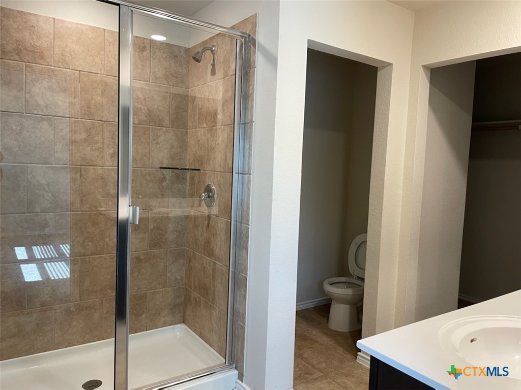 6114 Sally Ride Lane Killeen, TX 76543 - Photo 8 of 21 a bathroom with a shower and a toilet