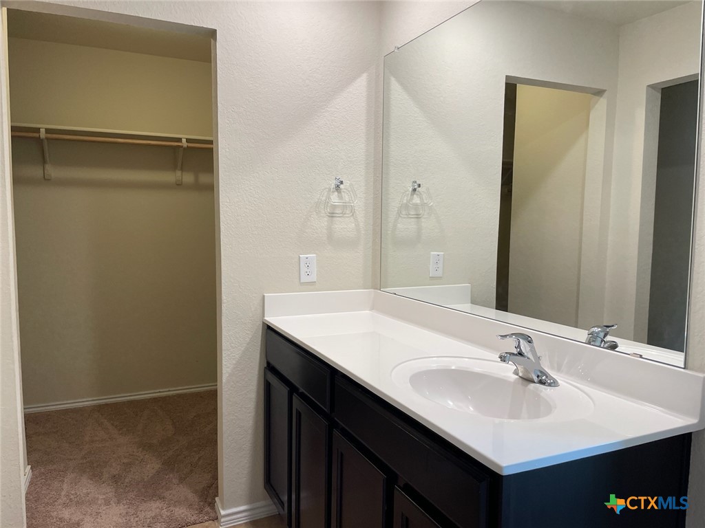 6114 Sally Ride Lane Killeen, TX 76543 - Photo 10 of 21 a bathroom with a sink and a mirror
