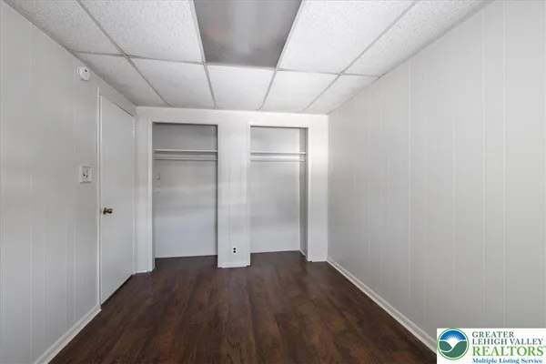 a view of hallway with wooden floor