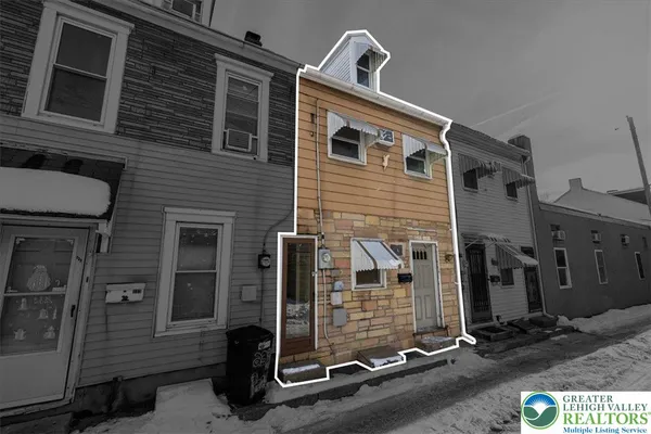 a front view of a house with parking